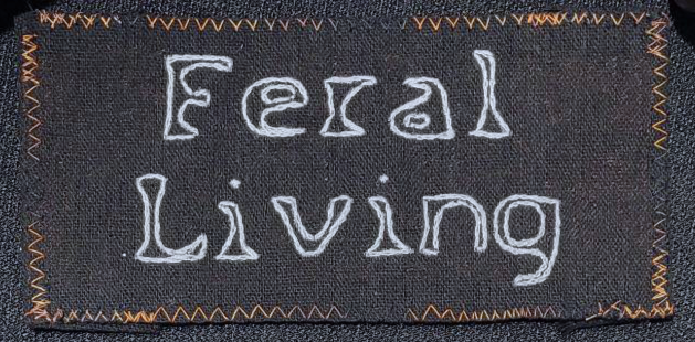 Feral Living sew on patch - Silver thread on Black canvas